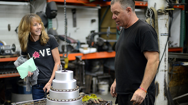 Rusty Oliver celebrates Art Zone with cake and flamethrower